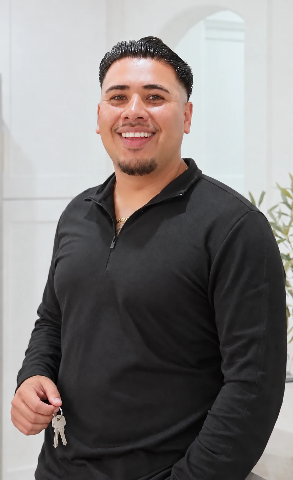 Steven Dominguez smiling and holding house keys